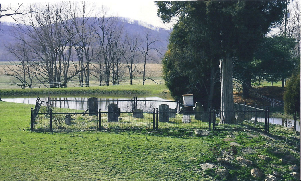 Use Photo 5 – The cemetery hive is on metal post of some kind. Unusual apiary site.