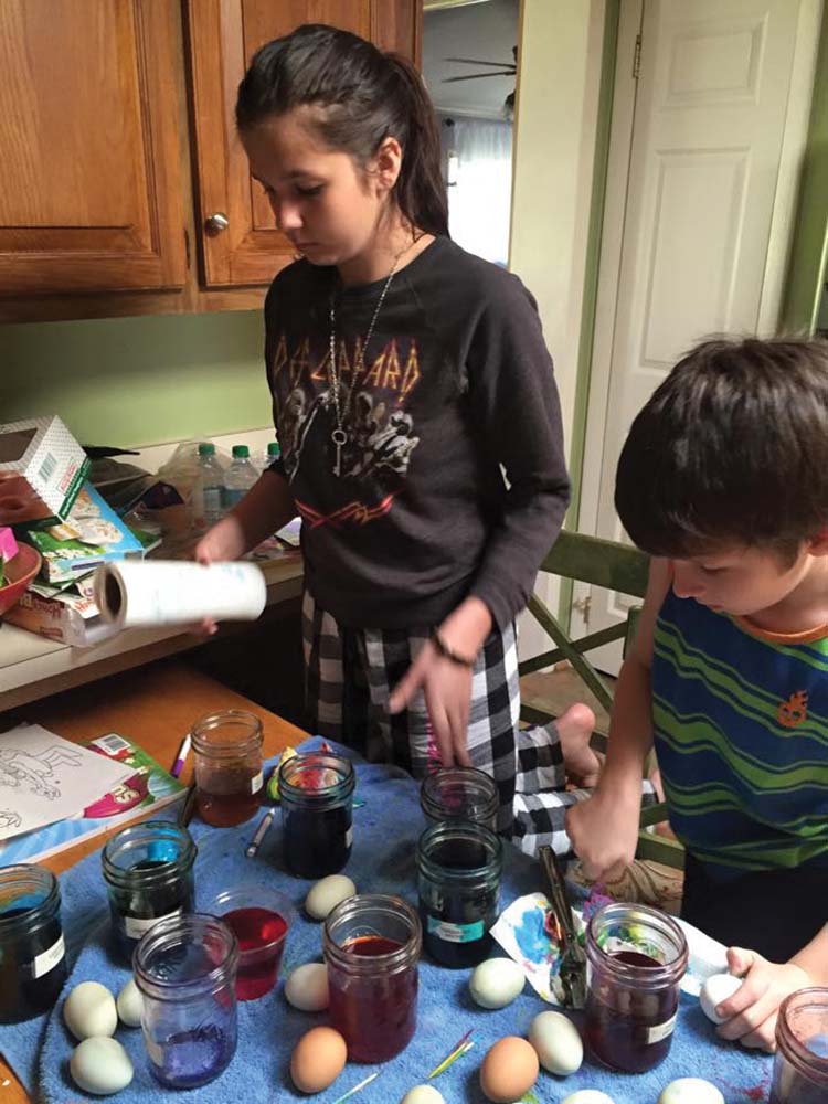 Maggie and George on egg dyeing.