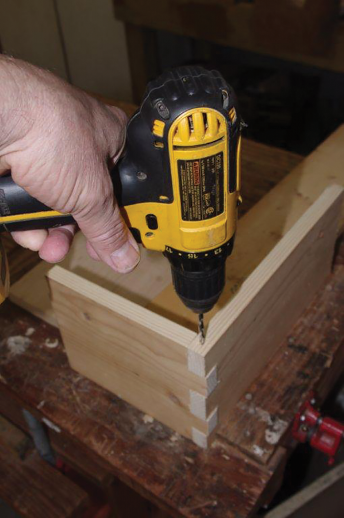 Clamp a piece in place and slide in its mate. Drill a pilot hole for the nail.